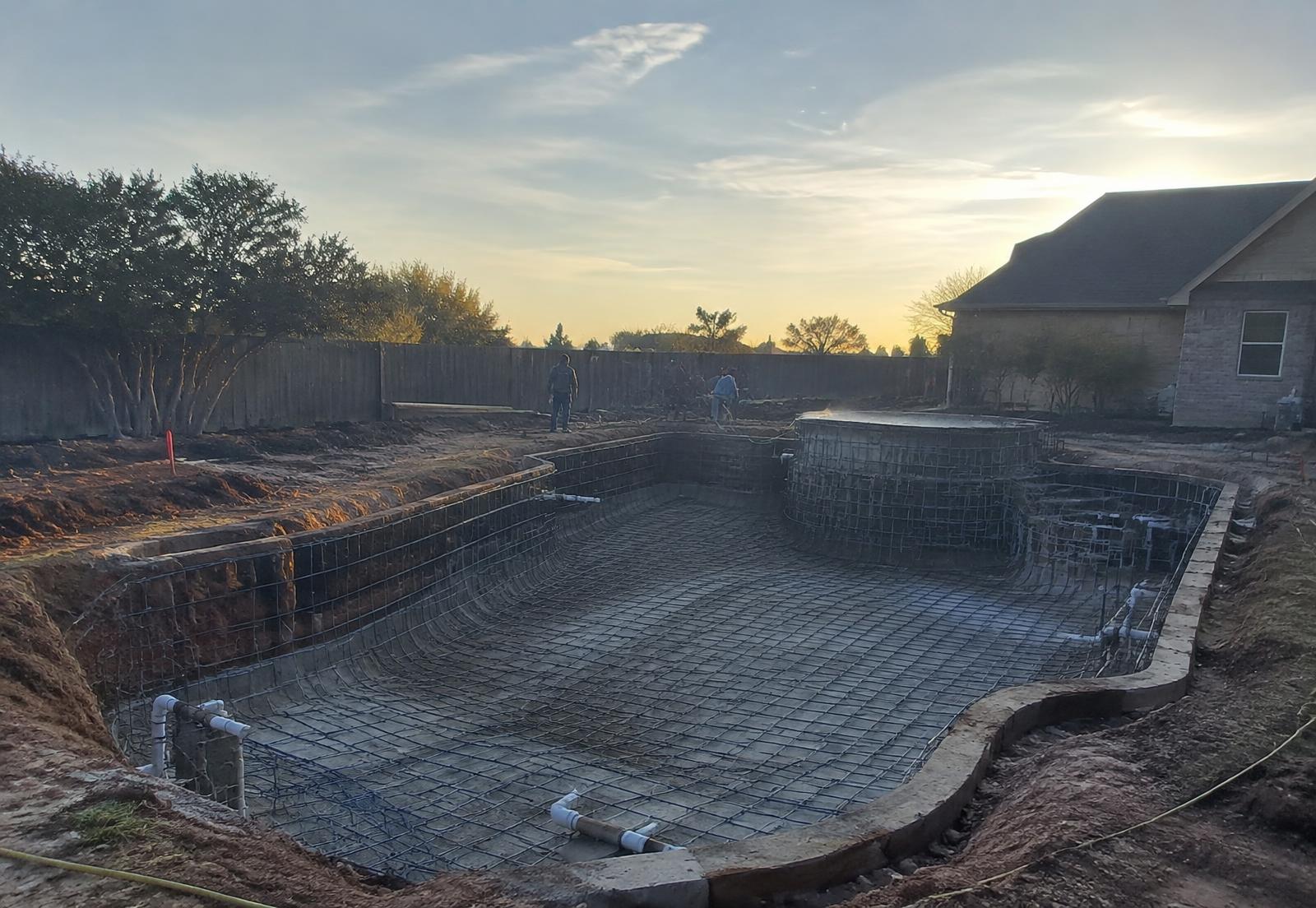 Pool construction in progress at sunrise