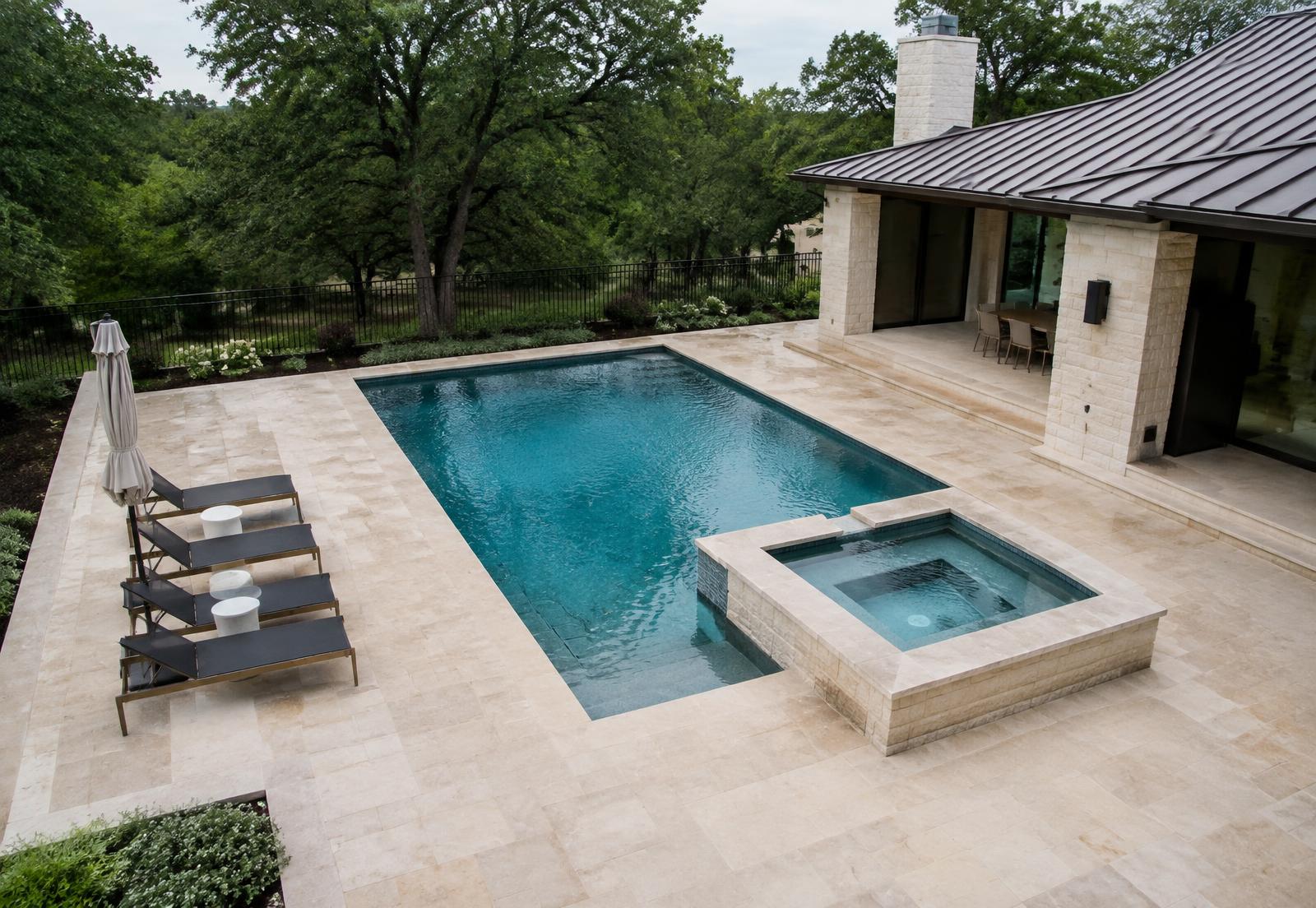 Pool and spa set into a limestone terrace